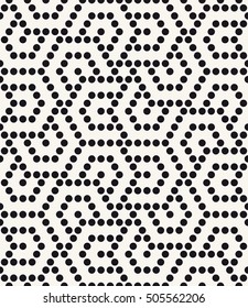 Vector seamless pattern. Modern stylish texture. Repeating geometric tiles with filled dots. Regular hipster background. Small circles form hexagonal minimalistic ornament.