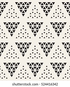 Vector seamless pattern. Modern stylish texture. Repeating geometric tiles with dotted triangles. Regular hipster background. Small triangles form triangular minimalistic ornament.