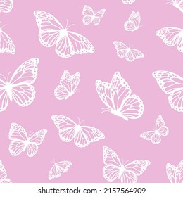 Vector seamless pattern with monarch butterflies on pink background