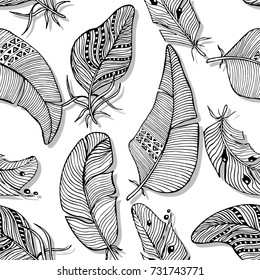 Vector seamless pattern. The monochrome background of various hand drawn feathers on white background.