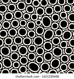 Vector seamless pattern. Monochrome organic circles and rings. Stylish structure of natural spots. Hand drawn abstract background. Can be used as swatch in Illustrator. Spotty monochrome print.
