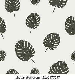 Vector seamless pattern with monstera leaves on a light background