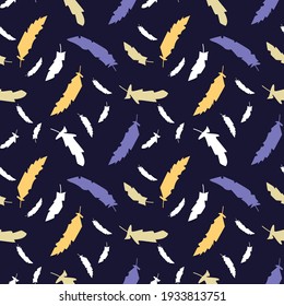Vector seamless pattern with multicolored feathers on a dark blue background. Perfect for printing on fabric, paper.
