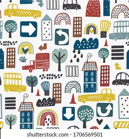 Vector seamless pattern with old and modern buildings, cars, road sign and trees. Good for kids fabric, textile, nursery wallpaper. Seamless city landscape. Cute city.