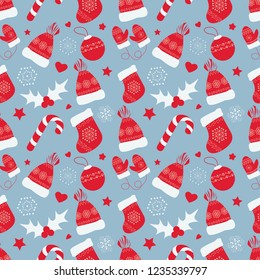 Vector seamless pattern on the Christmas theme.  
Background for wrapping paper that contains a Christmas boot, winter hat and gloves, Christmas-tree decorations.