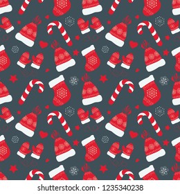 Vector seamless pattern on the Christmas theme.  
Background for wrapping paper that contains a Christmas boot, hat, gloves and candy.