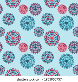 vector seamless pattern on light blue background with ethnic flowers in red and blue colours and big space between them