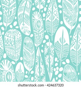 Vector seamless pattern of ornamental boho feathers