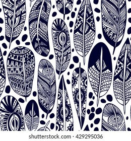 Vector seamless pattern of ornamental boho feathers
