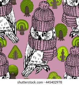 Vector seamless pattern with owls and trees. White owl in a pink knitted hat and scarf.