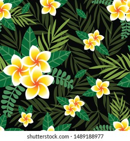 Vector seamless pattern palm leaves and plumeria flowers