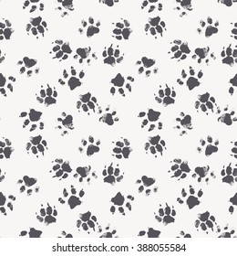 Vector seamless pattern with paw footprints of a dog (wolf). Cute hand drawn steps drawn with watercolors. Monochrome texture for consumer industry design