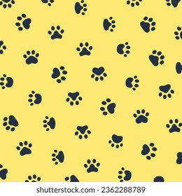 Vector seamless pattern with paw print on yellow background. animal print vector illustration