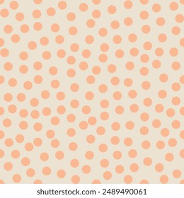 Vector seamless pattern of peach fluff dots on pristine background. Delicate peach dots on a light beige background.