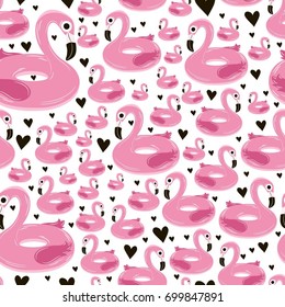 Vector seamless pattern with pink inflatable flamingos and black hearts