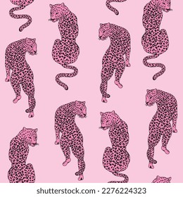 Vector seamless pattern with pink leopards. Trendy background with hand drawn wild cats