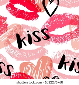 Vector seamless pattern with pink and red stamps of lipstick kisses. Romantic background for Valentine's day.