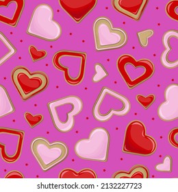Vector seamless pattern of pink and red cookies in the shape of hearts isolated on purple background.