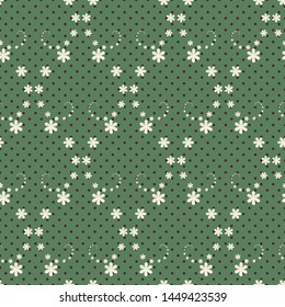 Vector seamless pattern with polka dots and swirly floral motifs in lozenged layout. Graphic green, cream and black illustration.