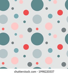 Vector seamless pattern with polka dots in different sizes, blue and pink shades on light blue background.For fabrics,prints,clothes,textile,decoration