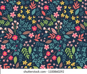 Vector seamless pattern. Pretty pattern in small flower. Small multicolor flowers. Dark blue background. Ditsy floral background. The elegant the template for fashion prints. 