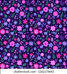 Vector seamless pattern. Pretty pattern in small multicolored flower. Small flowers. Dark blue background. Ditsy floral background. The elegant the template for fashion prints.