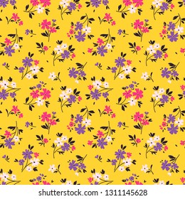 Vector seamless pattern. Pretty pattern in small flower. Small colorful flowers. Yellow background. Ditsy floral background. The elegant template for fashion prints.
