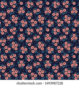 Vector seamless pattern. Pretty pattern in small flower. Small pink flowers. Dark blue background. Ditsy floral background. The elegant the template for fashion prints.