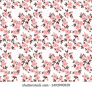 Vector seamless pattern. Pretty pattern in small flower. Small pink flowers. white background. Ditsy floral background. The elegant the template for fashion prints.