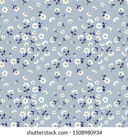 Vector seamless pattern. Pretty pattern in small flower. Small white flowers. Pale blue background. Ditsy floral background. The elegant the template for fashion prints.