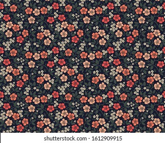 Vector seamless pattern. Pretty pattern in small flower. Small pale orange and coral flowers. Dark blue background. Ditsy floral background. The elegant the template for fashion prints.