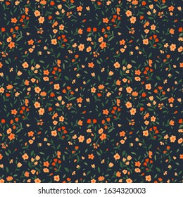 Vector seamless pattern. Pretty pattern in small flower. Small orange colour flowers. Dark blue background. Ditsy floral background. The elegant the template for fashion prints.