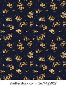 Vector seamless pattern. Pretty pattern in small flowers. Small yellow flowers. Dark blue background. Ditsy floral background. The elegant the template for fashion prints.
