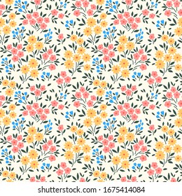 Vector seamless pattern. Pretty pattern in small flower. Small yellow, pink and pale blue flowers. White background. Ditsy floral background. The elegant the template for fashion prints.