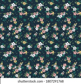 Vector seamless pattern. Pretty pattern in small flowers. Small pink and white flowers. Dark blue background. Ditsy floral background. The elegant the template for fashion prints.