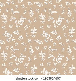 Vector seamless pattern. Pretty pattern in small flowers. Small white flowers. light beige background. Ditsy floral background. The elegant the template for fashion prints.