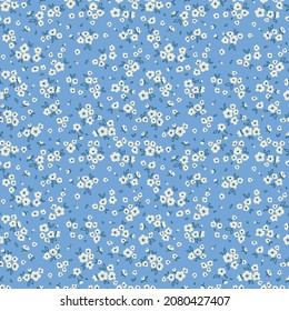 Vector seamless pattern. Pretty pattern in small flowers. Small white flowers. Pale blue background. Ditsy floral background. The elegant the template for fashion prints. Stock vector.