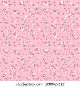 Vector seamless pattern. Pretty pattern in small flowers. Small white and pink flowers. Pale pink background. Ditsy floral background. The elegant the template for fashion prints. Stock vector.