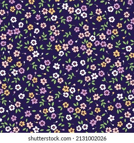 Vector seamless pattern. Pretty pattern in small flowers. Small colorful flowers. Blue background. Ditsy floral background. The elegant the template for fashion prints. Stock vector.