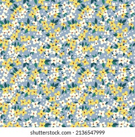 Vector seamless pattern. Pretty pattern in small flowers. Small yellow and white flowers. Gray blue background. Ditsy floral background. The elegant the template for fashion prints. Stock vector.