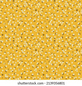 Vector seamless pattern. Pretty pattern in small flowers. Small white flowers. Pale yellow background. Ditsy floral background. The elegant the template for fashion prints. Stock vector.