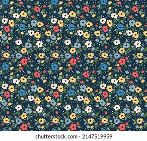 Vector seamless pattern. Pretty pattern in small flowers. Small colorful flowers. Dark blue background. Ditsy floral background. The elegant the template for fashion prints. Stock vector.