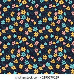 Vector seamless pattern. Pretty pattern in small flowers. Small colorful flowers. Dark blue background. Ditsy floral background. The vintage template for fashion prints. Stock vector.