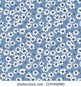 Patrón veloz. Patrón bonito en flores pequeñas. Pequeñas flores blancas. Fondo azul. Fondo floral de color marrón. La plantilla vintage para impresiones de moda. Vector de material.