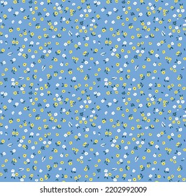 Vector seamless pattern. Pretty pattern in small flowers. Small white and yellow flowers. Pale blue background. Ditsy floral background. The elegant the template for fashion prints. Stock vector.
