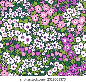 Vector seamless pattern. Pretty pattern in small flowers. Small white and violet flowers. Green background. Ditsy floral background. Cute template for fashion prints. Stock vector.