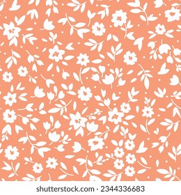 Vector seamless pattern. Pretty pattern in small flower on orange 
background. Ditsy floral background. The elegant the template for fashion prints.
