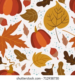 Vector seamless pattern with pumpkin, aspen, oak and maple leaves on white background. Perfect for wallpaper, gift paper, autumn greeting cards.