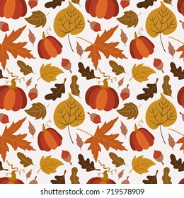 Vector seamless pattern with pumpkin,aspen, oak and maple leaves on white background. Perfect for wallpaper, gift paper, autumn greeting cards.