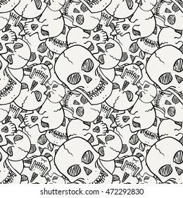 Vector seamless pattern with random skulls. Scary design.